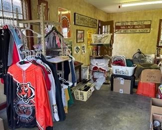 Clothing + 25 cent baskets + Antique Signs
