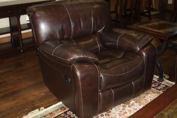 pair of large high grade fine leather reclining chairs, also matching sofa and love seat.