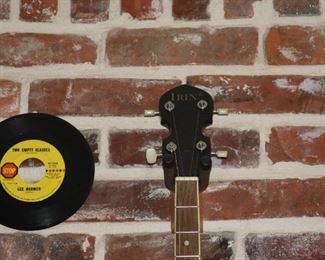 Rogue steel string guitar, Rogue mandolin, Irin banjo, electric cigar box guitar and a violin.  