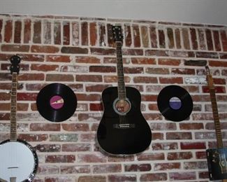 Rogue steel string guitar, Rogue mandolin, Irin banjo, electric cigar box guitar and a violin.  