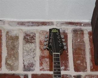 Rogue steel string guitar, Rogue mandolin, Irin banjo, electric cigar box guitar and a violin.  