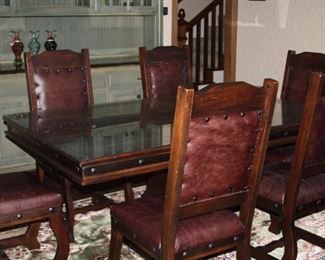 large dining table with 6-leather chairs