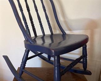 $25.00. Small & low “14” seat.  Nursing ,knitting,  or youth rocking chair.   Multiple coats of paint it’s deep blue now.  Bend wood bow back 1930s.