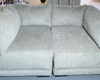 Ashley 2 piece Modular Sofa  77 " long x 37 1/2" top of end pillow 36" high  pretty shade of Grey  $1060 offered for $475 Other pieces to this Collection are in pictures 