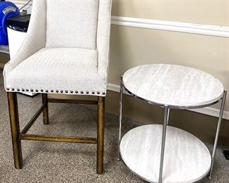 Pair of round white side tables offered for $85 each. Ivory and brown contemporary chair offered for $75