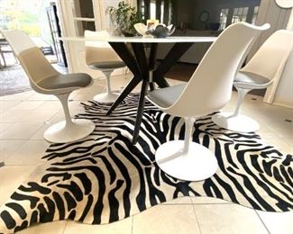 Arhaus Circular Frosted Glass Table 54" x 30" high  3 Yrs Old  $595   Table & Chairs Sold Separately 4 White  with grey cushions  31" tall 19 1/2 " wide 20" deep  17" tall to seat $125 each  "This is Our Fav"  Arhaus  Zebra Rug  85" long    $399     Buy it Now! 