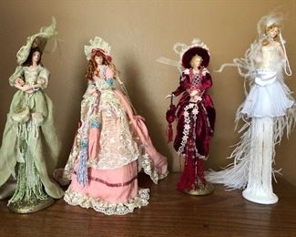 $3.00 Lot of 4 Popular Creations Porcelain Dolls on stands. All for $ 3.00 The doll with the white dress has a few spots on the dress. 