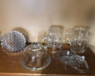 $5.00 for the Lot of Serving Glassware all for $5.00 includes 2 Vintage Federal Glass Starburst Square Pitcher with Star on the bottom, Dome covered dish,Flower etched covered dish, Heavy bowl (shown upside down to see the detail. 