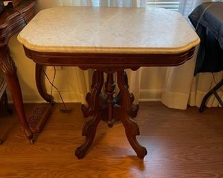 antique marble top table on casters 