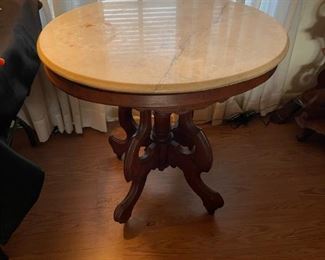 antique marble top table on casters 