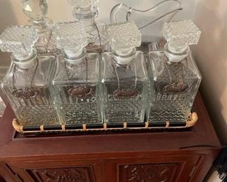 Nice selection of decanters, sterling name tags sold separate. 