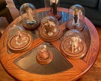 D. Baldessari Clay Figurine Art Pieces under Domes