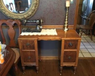 Desk with large metal candle stick & vintage sewing machine 