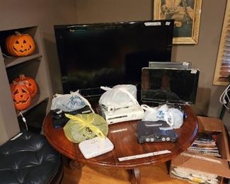 Upstairs  - Coffee table, TV, pumpkins, computer screen & stool