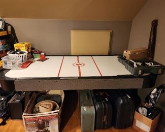 Upstairs  - Air hockey table, suitcases, miscellaneous 