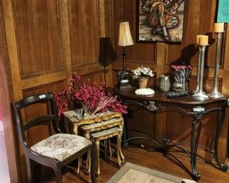 Downstairs - room to left from entrance - Chair, stacking tables, candles, lamp, painting, small rug