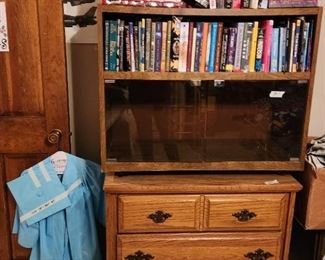 Upstairs bedroom - chest, bookcase, books
