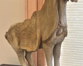 Carved horse on base
