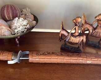 Saber with scabbard; carved wooden figures