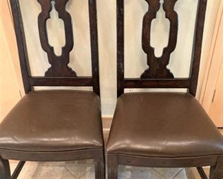 Two of eight very sturdy dining table