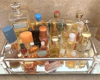 Another mirrored tray with small colognes