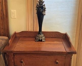One of two matching nightstands and lamps