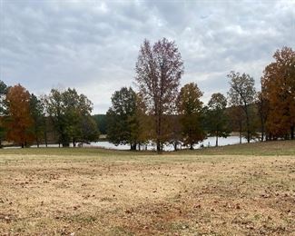 Beautiful scenic lake, lined with fall foliage. 