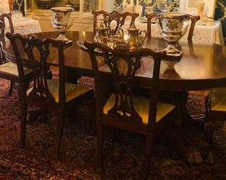 Beautiful mahogany pedestal dining table with carved paw feet. It includes six Chippendale chairs-
Gorgeous and perfect for the holidays
