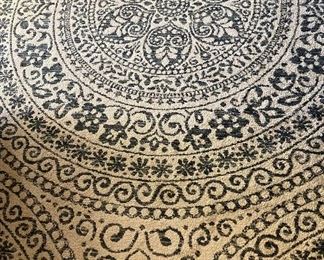 Area rug, 78βx 110β tan with navy blue design