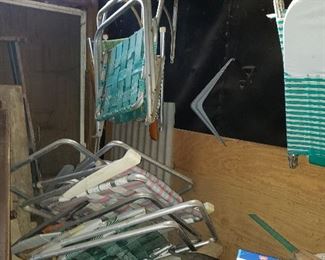 Several lawn chairs waiting to be rewebbed