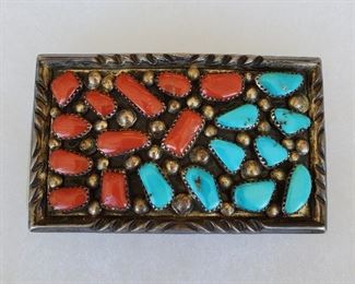 Sterling silver belt buckle set with coral and turquoise by Zuni artists Dave & Celia Nieto. Their work is in the National Museum of the American Indian at the Smithsonian. Circa 1980s. 1 3/4" x 3".