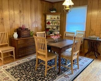 Antique dining room table with modern chairs