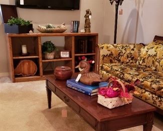 Cubed bookcase, decor, Heritage coffee table, sofa, floor lamp.  Flat screen TV on wall NOT FOR SALE