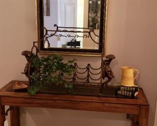 Library table, heavy brass wine rack with elephants, mirror