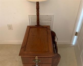 Magazine table with attached lamp