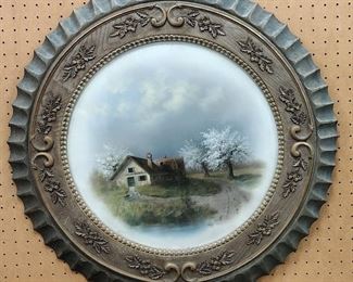 OIL PASTEL PAINTING OF A HOUSE . DISPLAYED IN A ROUND FRAME