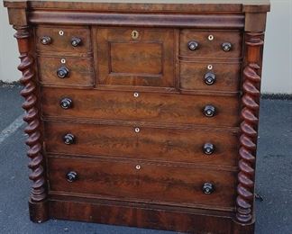 ANTIQUE SCOTTISH CHEST OF DRAWERS. HAS EIGHT CONVEX DRAWERS, ONE WITH FAUX FRONTS FOR HATS. UPPER DRAWER LOOKS LIKE PART OF THE TRIM FOUR USE AS A HIDDEN DRAWER. 50.5" WIDE , 24.25" DEEP, 49.25" TALL. FEET HAVE BEEN REMOVED. VENEER AND TRIM CHIPS