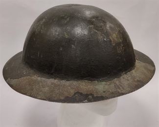 WWI CANADIAN BRODIE HELMET, CAP ONLY NO LINER OR STRAPS. PARTIAL RED INSIGNIA PAINTED ON THE FRONT