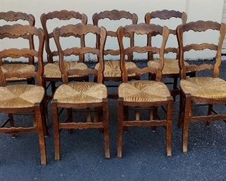 SET OF EIGHT PETITE FRENCH COUNTRY STYLE DINING CHAIRS WITH RUSH SEATS. SEATS ARE 18.5" FROM FLOOR