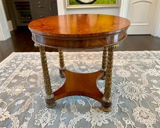 L. Brandy's inlaid wood and brass center table $850.00                         31"h x 34" diameter