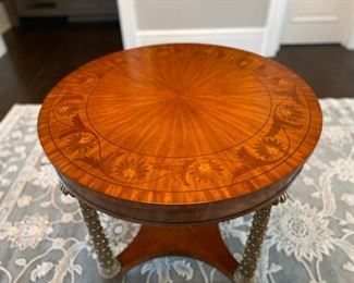L. Brandy's inlaid wood and brass center table $850.00                         31"h x 34" diameter