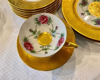 Heinrich & Co. Gold bordered floral china $250.00         1 platter, 7 8" plates, 2 10" dinner plates (some burnishing to gilding), 8 61/2" plates, 1 cup, 5 saucers
