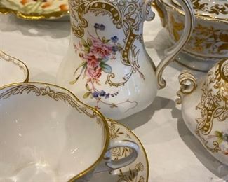 Dainty floral tea cups, saucers creamer & sugar 