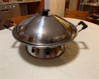 Large WokGiant Wok and Bamboo Steamer ($15 each)
A fun way to cook healthy – and fast!
Everyone needs a wok in their kitchen!
While it is mainly used for stir-frying, you can use your wok to braise, stew, steam, deep-fry, or smoke.
This wok cooks quickly, and enables you to stir-fry food with less oil. The curved and round shape cooks food with less oil. It’s so big, it got a larger capacity to cook food compared to most frying pans.
While the Wok has been used, the Bamboo Steamer has not. 