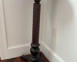 Tall Empire Round Column Pedestal (Plant Stand)
$40

French country farmhouse flair abounds in this Provencal pedestal plant stand! Crafted of solid wood with hardwood veneer, this plant stand strikes a Victorian silhouette – perfect for displaying everything from a retro telephone to a vase of fresh flowers. Its slender base features a long column showcasing carved and turned details.

Quality craftsmanship, great style and form. Circa 1900s. It measures 36" high with a 14" diameter top yet its base is what makes this piece special: It is positioned on a solid, sturdy 13" stand that perfectly compliments the design.

You’ll love how this accent table looks in your living room or serving as a table in your entryway. There's plenty of room on its 14" diameter surface for a large plant, a framed family photo or an accent lamp.

There is slight buckling of the top veneer .

