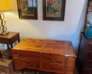 Cedar chest and Oriental framed prints