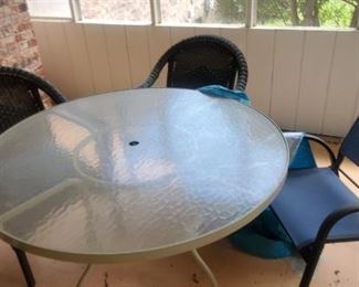 Glass top patio table and chairs