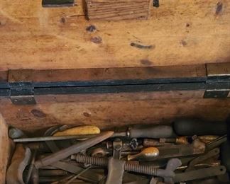 Early homemade toolbox with clamps, files and other tools