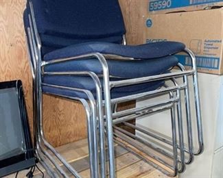 Four high quality sturdy stacking chairs in excellent condition