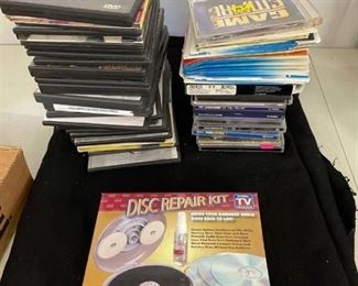 NIB Disc repair kit and stacks of empty CD/DVD cases